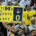 Michigan fans hold a sign indicating the time out remaining for Michigan in the second half of the Final Four in Atlanta on Saturday, April 6, 2013. Melanie Maxwell I AnnArbor.com